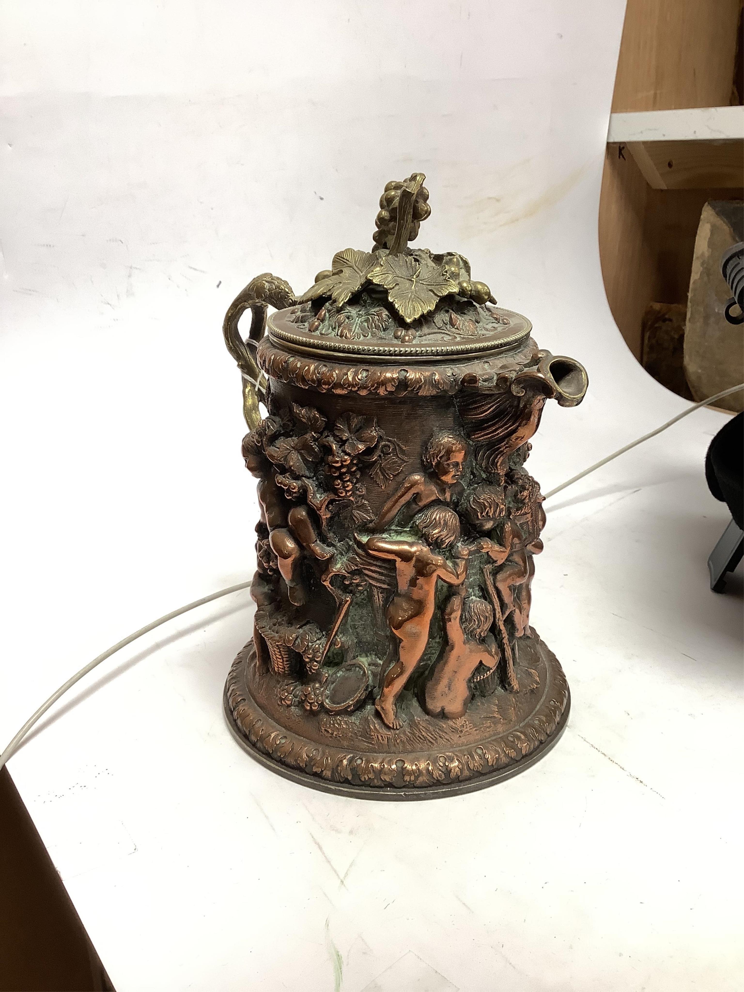 A copper Bacchus jug trophy, presentation inscription 1872, 21cm